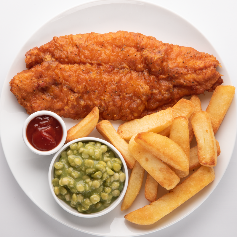 Masala basa fish fillet with fries. Fish and chips.